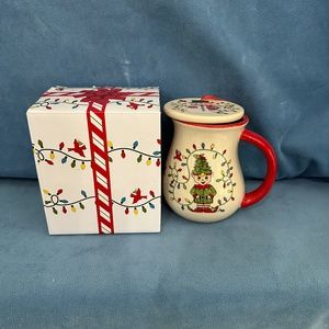 New, Temptations ceramic 16 oz holiday mug with ornament.